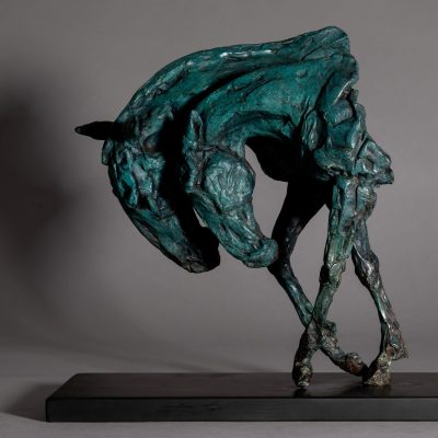 Bronze sculpture of two intertwined horse heads with elongated ears, rendered in a turquoise verdigris finish, symbolising love and hope, mounted on a slate base.