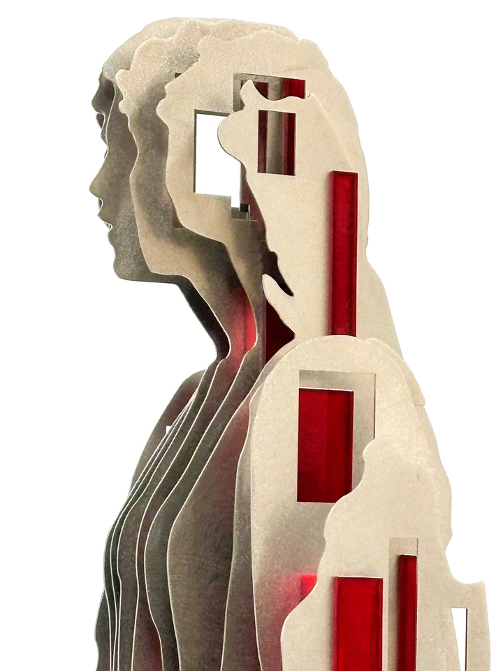 Sculpture titled Seated Girl I by Tom Hiscox, composed of layered stainless steel with red resin inserts forming a stylised seated female figure, shown from multiple angles on a brushed circular base.