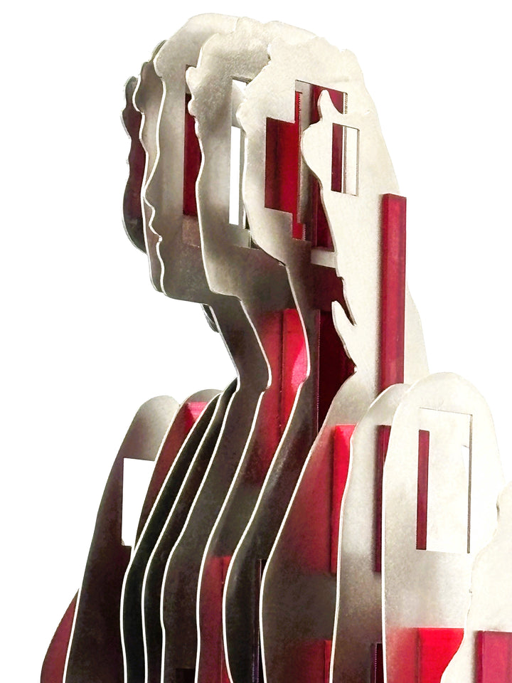 Sculpture titled Seated Girl I by Tom Hiscox, composed of layered stainless steel with red resin inserts forming a stylised seated female figure, shown from multiple angles on a brushed circular base.