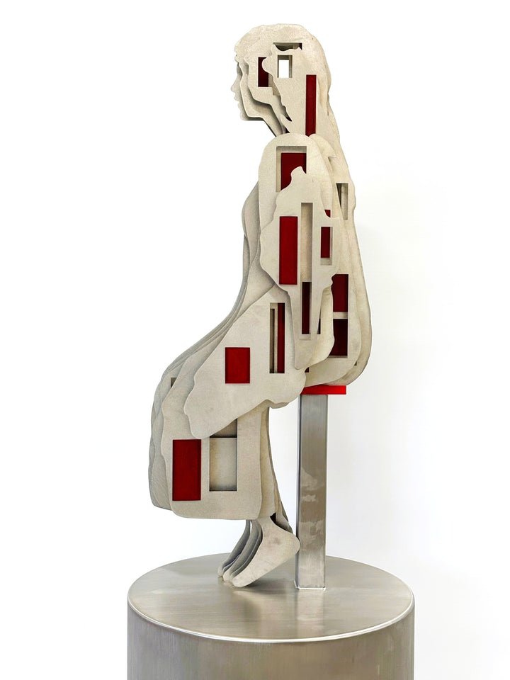 Sculpture titled Seated Girl I by Tom Hiscox, composed of layered stainless steel with red resin inserts forming a stylised seated female figure, shown from multiple angles on a brushed circular base.