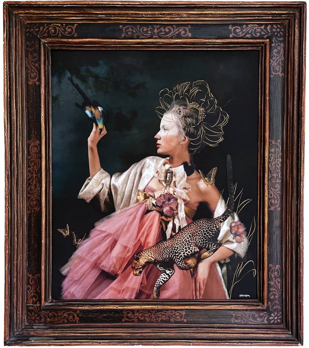 Catarina Diaz’s Set You Free, analogue collage on Somerset Enhanced Velvet with oil on canvas. Rococo-inspired woman in pink gown and ivory robe holds leopard, raises hand to blue-and-gold bird, framed by butterflies and flowers against deep dark backdrop.