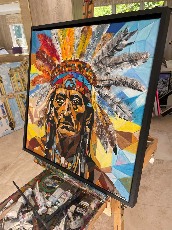 Abstract portrait of a man in a colourful feathered headdress, composed of bold geometric shapes and vibrant earth tones.

