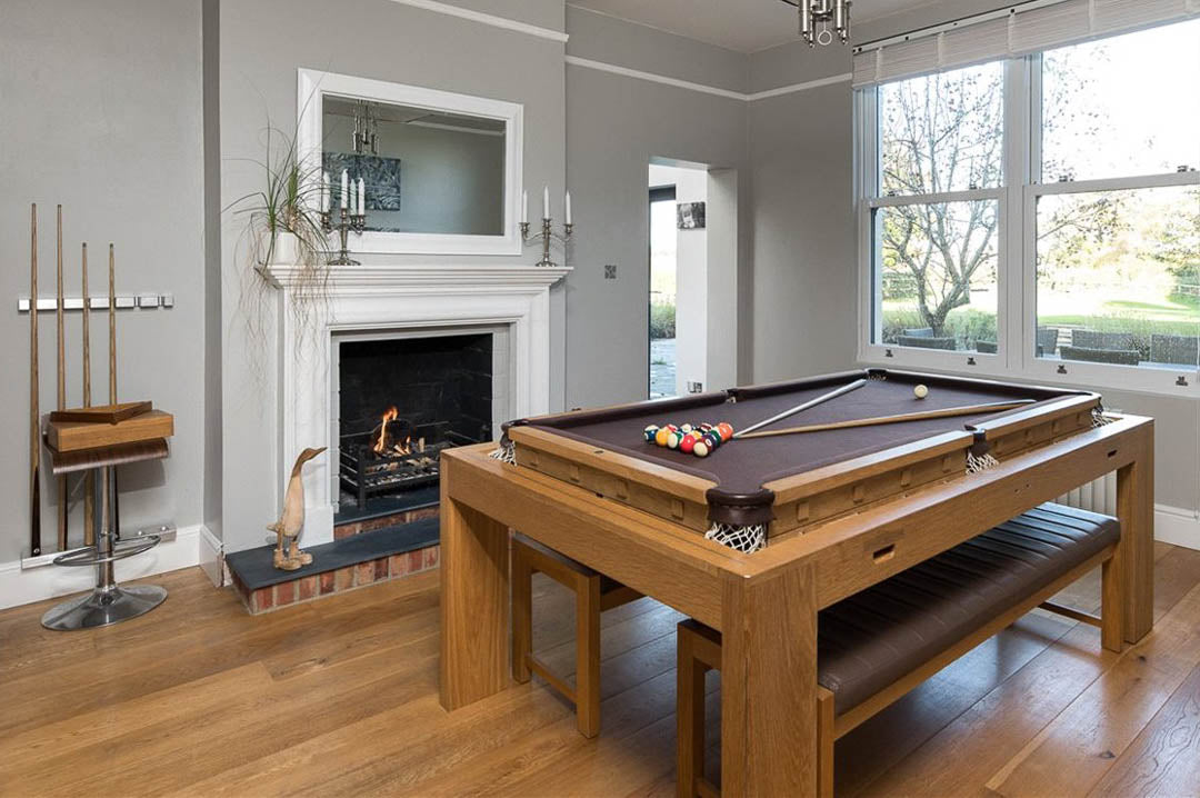 Sir William Bentley Billiards Speed Rollover 6ft dual-purpose pool table in solid oak with concealed playing surface and integrated dining design.