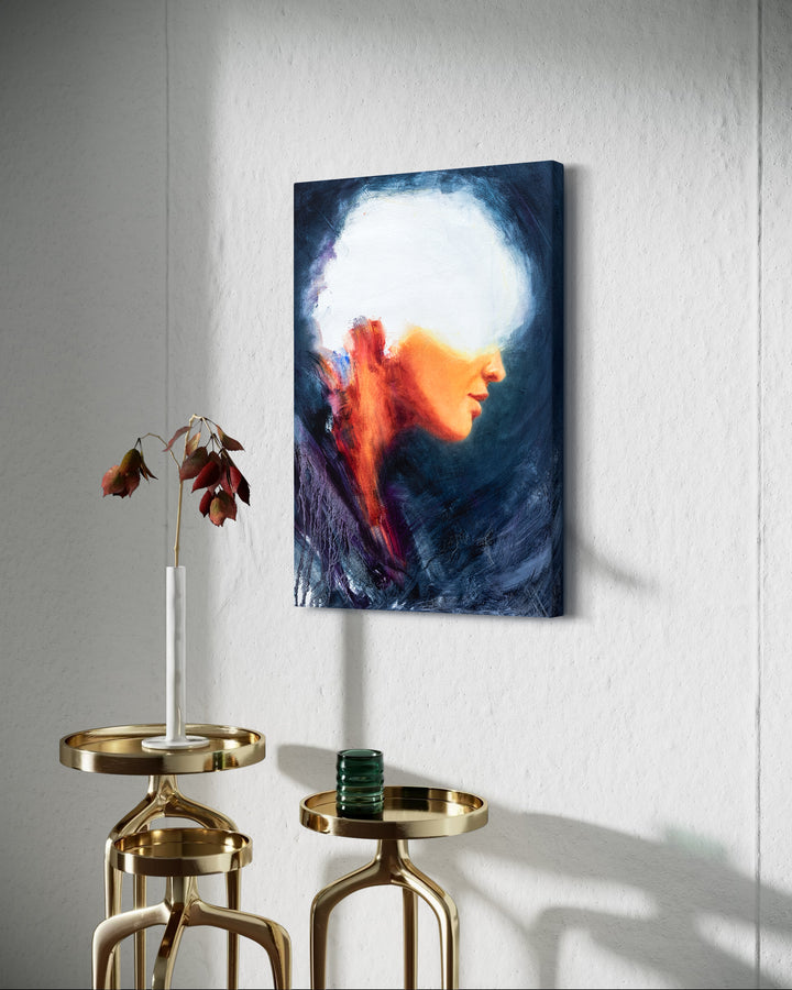 Oil on canvas painting by Dan Bullock, titled Spellbound. A semi-abstract portrait of a woman in profile, her face softly lit in warm peach and orange tones, contrasted against deep navy and indigo brushwork. The upper head dissolves into white light, creating a sense of mystery and transcendence. The expressive textures and layered brushstrokes convey both fragility and strength.