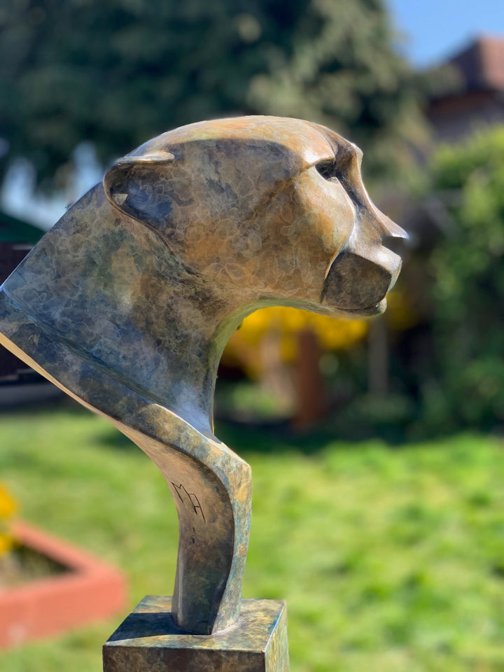 Marie Ackers Spirit of Savannah bronze sculpture, limited edition of 8. Stylised cheetah head and shoulders with flowing geometric lines, patinated in earthy green and bronze tones, evoking the spirit and elegance of Africa’s great cats.