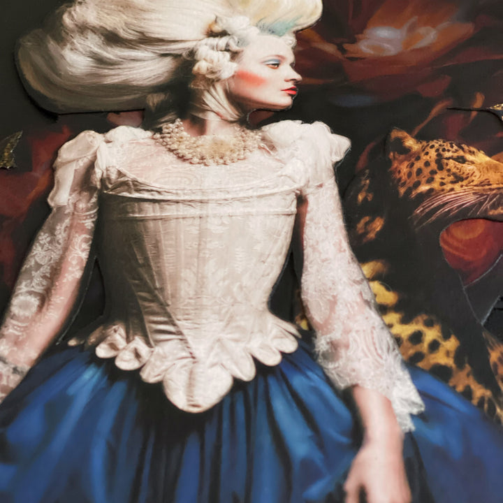 Catarina Diaz’s Splendour, analogue collage on Somerset Enhanced Velvet with oil on gesso-primed canvas. Rococo-inspired woman with towering white coiffure, lace bodice, and blue skirt stands beside a leopard, golden hummingbird, and butterflies over deep floral backdrop.