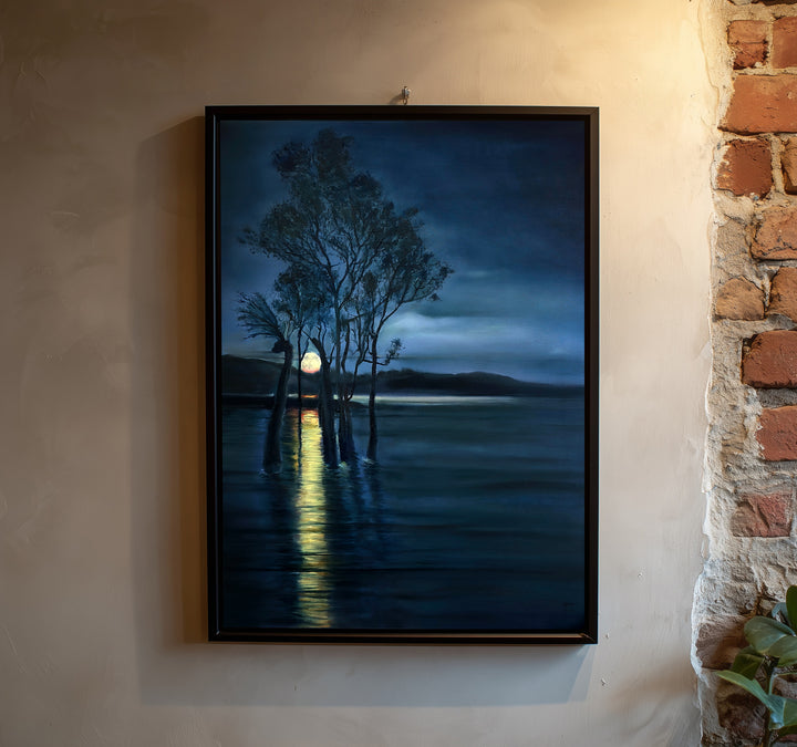 Moonrise by Ewan Story – oil on canvas painting of silhouetted trees rising from still water beneath a deep indigo night sky, a golden moon reflecting across dark blue tones, atmospheric contemporary landscape wall art from The Collection.