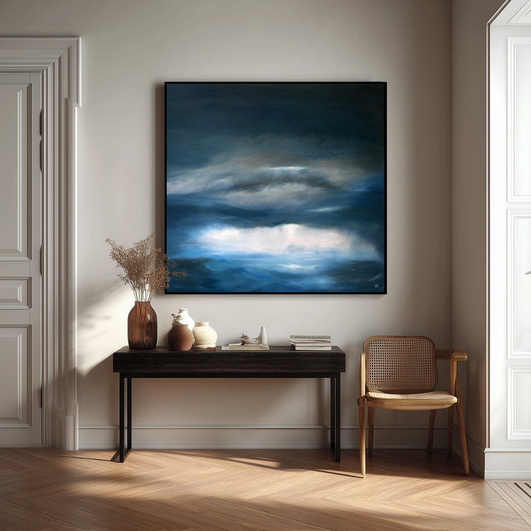 Pelagic by Ewan Story – large square oil on canvas seascape in deep blue, navy and slate grey tones, with layered storm clouds and soft white light breaking over a restless ocean horizon, contemporary atmospheric wall art from The Collection.