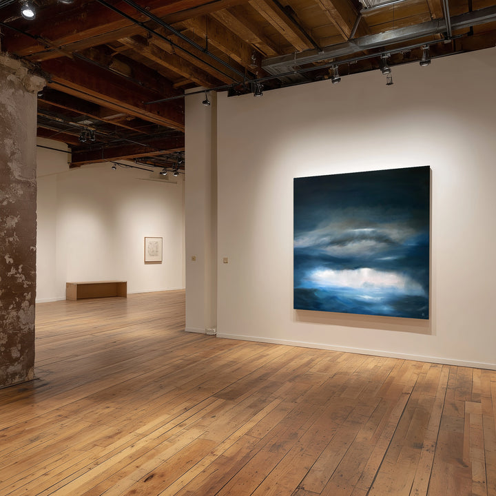 Pelagic by Ewan Story – large square oil on canvas seascape in deep blue, navy and slate grey tones, with layered storm clouds and soft white light breaking over a restless ocean horizon, contemporary atmospheric wall art from The Collection.