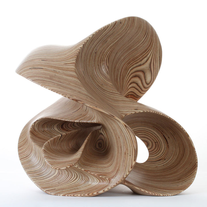Hand-carved birch plywood abstract sculpture with flowing, mathematical forms inspired by chaotic systems and the Halvorsen Attractor.