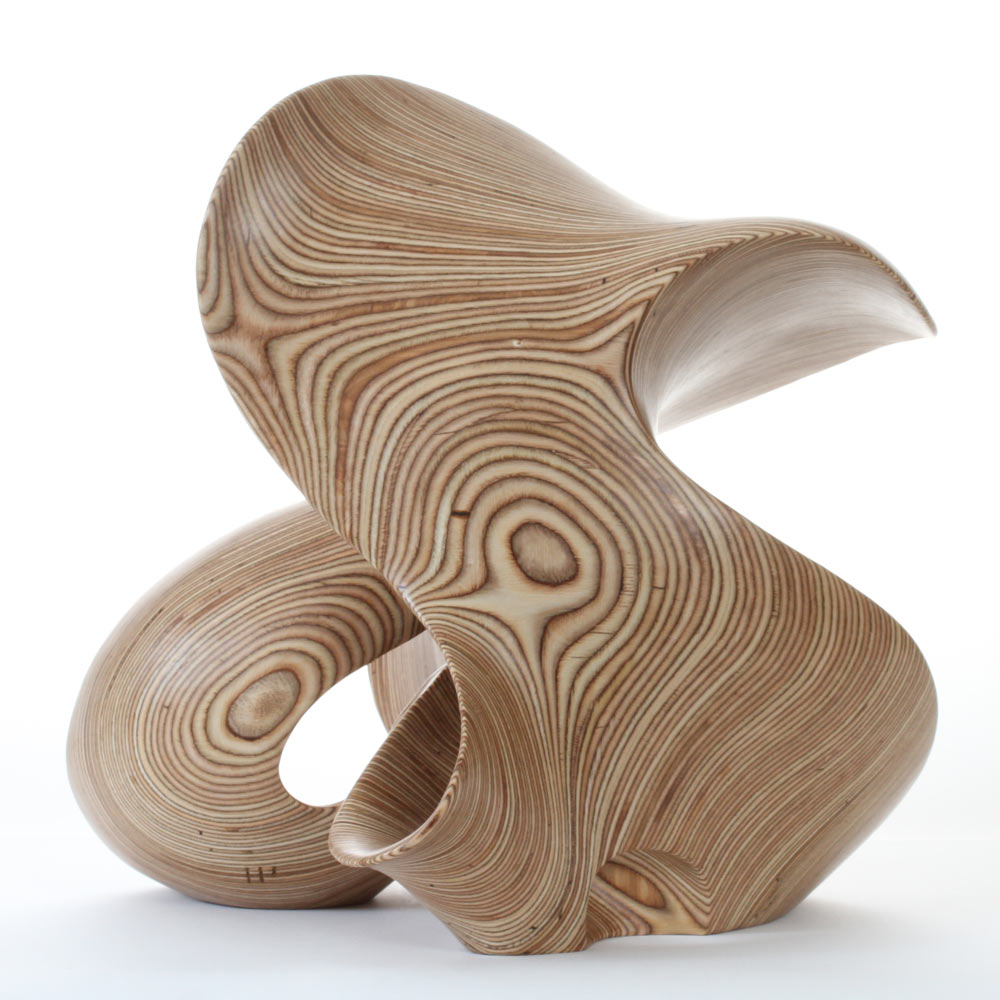 Hand-carved birch plywood abstract sculpture with flowing, mathematical forms inspired by chaotic systems and the Halvorsen Attractor.