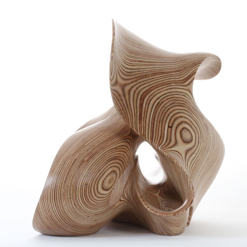Hand-carved birch plywood abstract sculpture with flowing, mathematical forms inspired by chaotic systems and the Halvorsen Attractor.