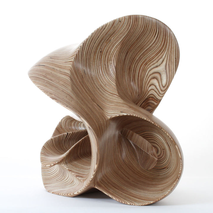 Hand-carved birch plywood abstract sculpture with flowing, mathematical forms inspired by chaotic systems and the Halvorsen Attractor.
