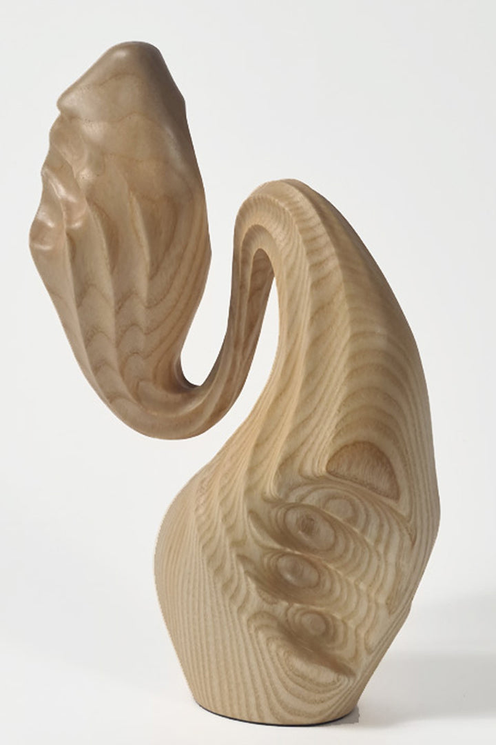 Hand-carved ash wood abstract sculpture with elongated, folded organic forms inspired by stretched sculpting wax and natural movement.