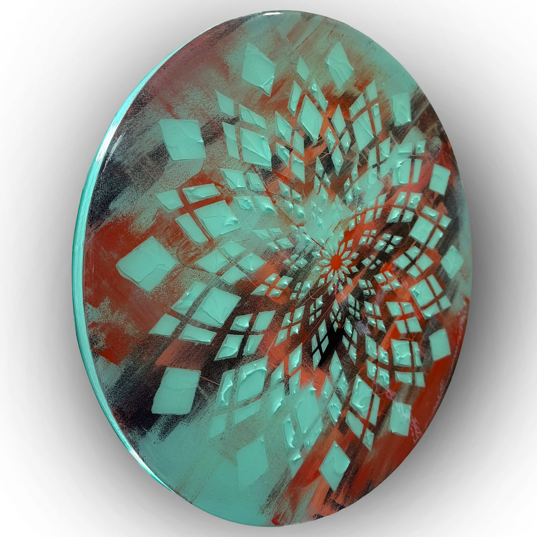Contemporary circular wall artwork by Mike Philp built from layered teal geometric forms radiating outward against warmer undertones. The high-gloss resin surface amplifies movement, depth, and visual flow.
