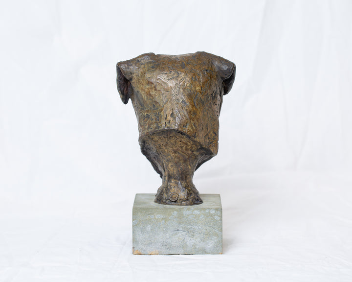 Sidney Border Terrier bronze sculpture by Tom Saxton mounted on a Cotswold stone plinth, expressive dog portrait bust with textured fur in warm copper-brown and dark bronze tones, contemporary canine bronze sculpture