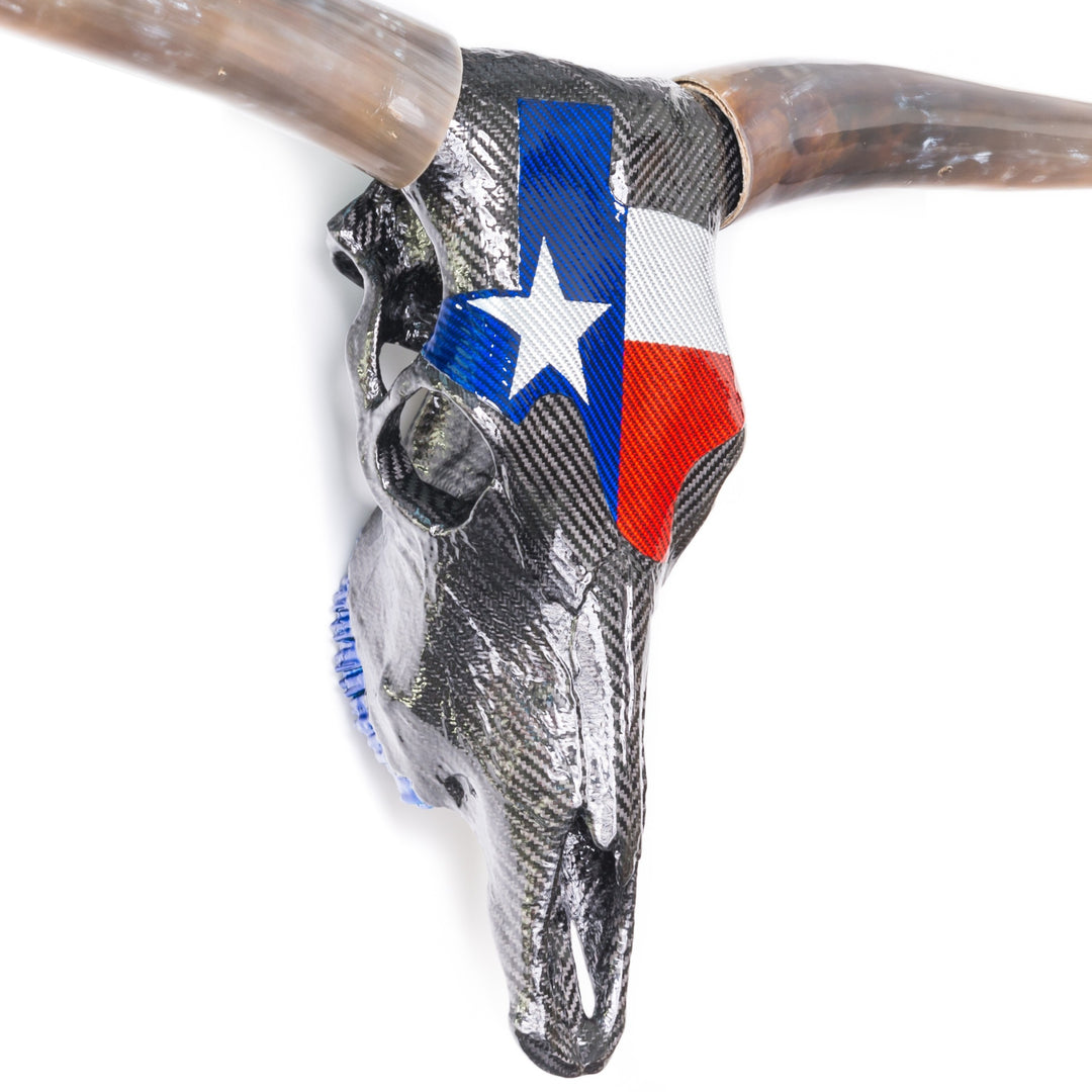 Alastair Gibson CarbonArt45 Texas Longhorn skull sculpture in carbon fibre with Texalium Texas flag detail, polished natural horns and titanium Formula One components
