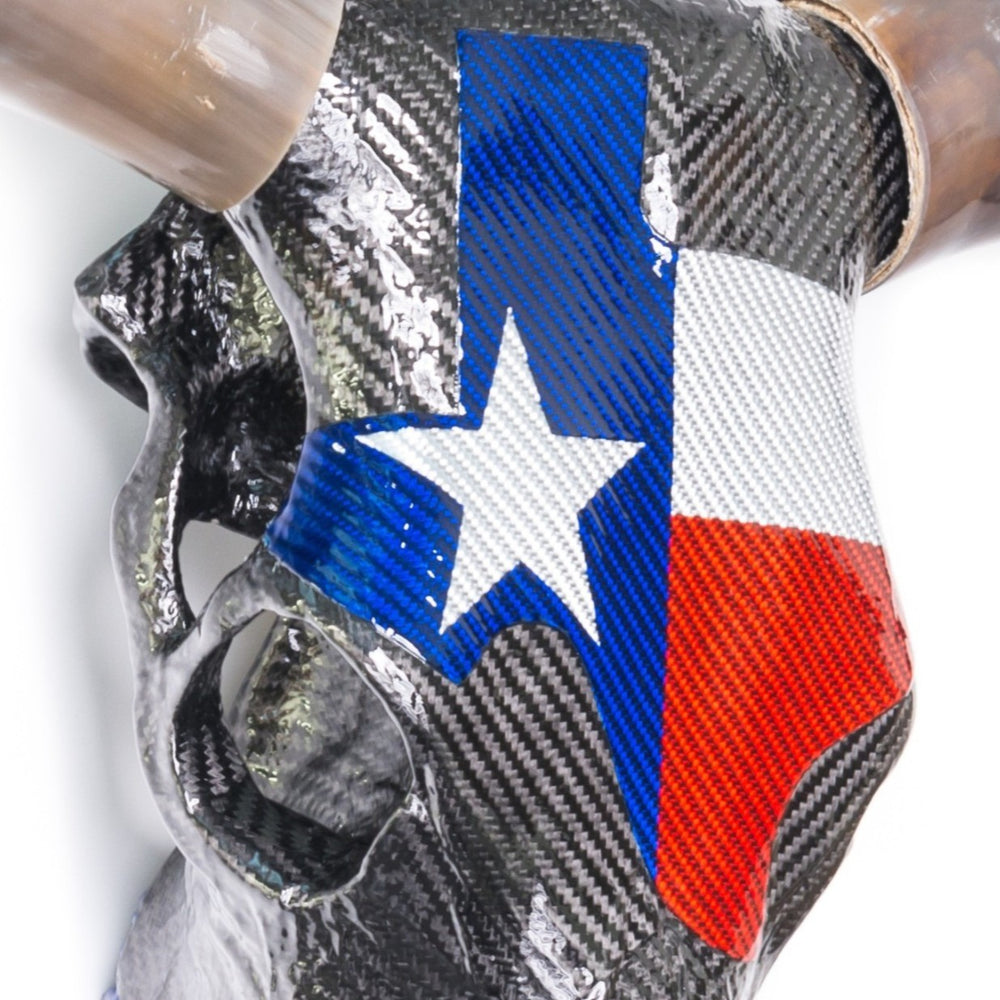 Alastair Gibson CarbonArt45 Texas Longhorn skull sculpture in carbon fibre with Texalium Texas flag detail, polished natural horns and titanium Formula One components
