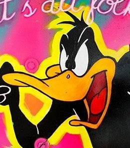 Spray-painted artwork of Daffy Duck pointing with the phrase “That’s all folks!” in neon colours on a circular surface.
