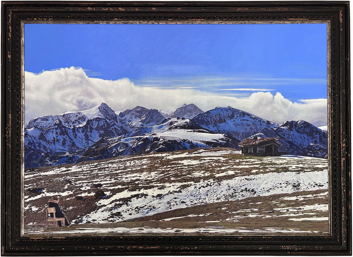 James Earley The Magic Door realism Print depicting a young boy seated alone on a chair overlooking a vast Pyrenean mountain landscape, with snow-covered peaks stretching beneath a deep blue sky. The composition balances solitude and openness, with the small figure placed against an expansive horizon, evoking quiet reflection, emotional release and a sense of escape into nature.
