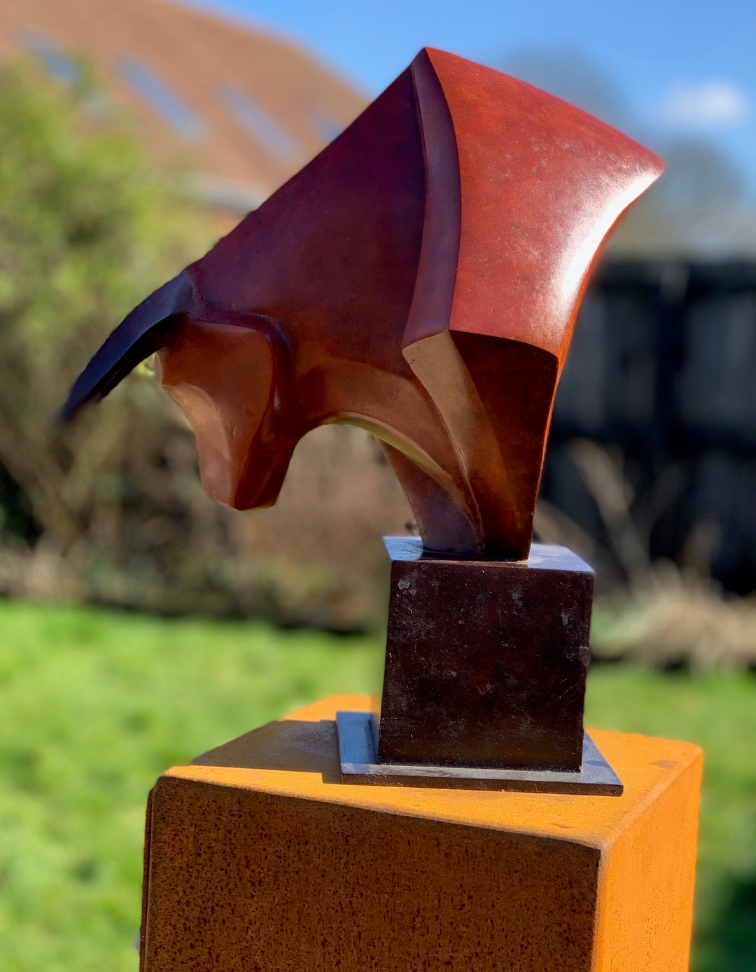 Marie Ackers The Bull’s Head bronze sculpture — stylised abstract bull head with powerful downward stance, geometric lines and deep red patina. Signed, numbered, and foundry stamped with certificate of authenticity.