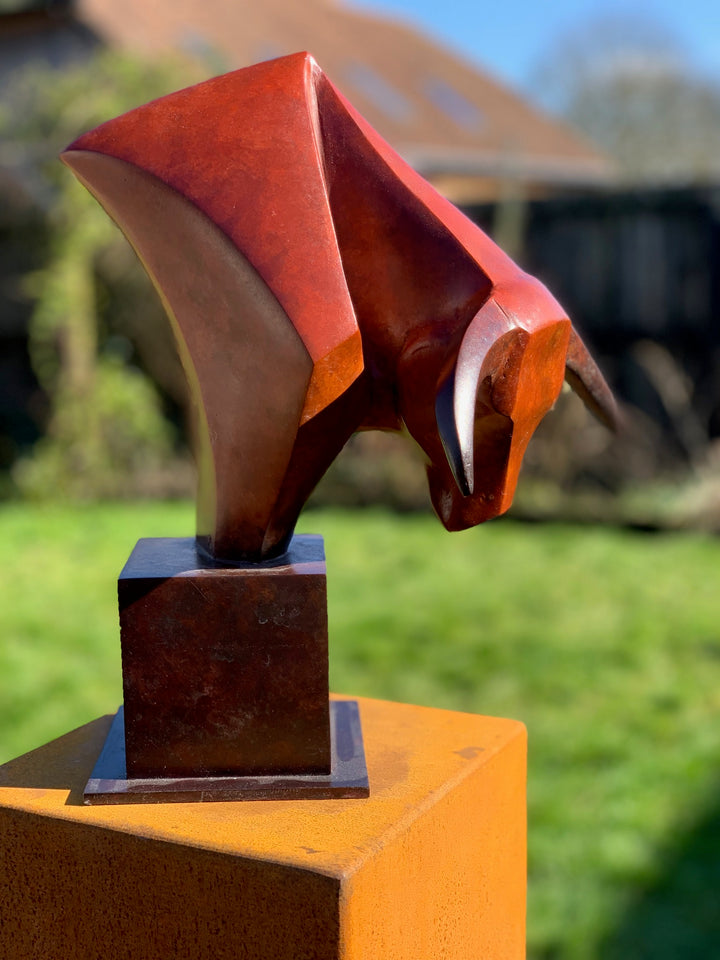 Marie Ackers The Bull’s Head bronze sculpture — stylised abstract bull head with powerful downward stance, geometric lines and deep red patina. Signed, numbered, and foundry stamped with certificate of authenticity.