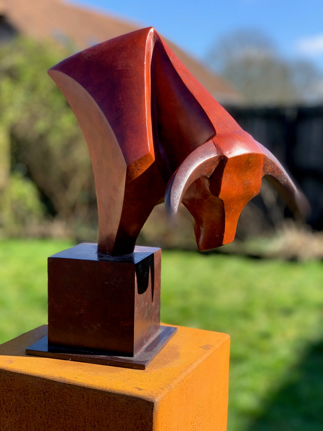 Marie Ackers The Bull’s Head bronze sculpture — stylised abstract bull head with powerful downward stance, geometric lines and deep red patina. Signed, numbered, and foundry stamped with certificate of authenticity.