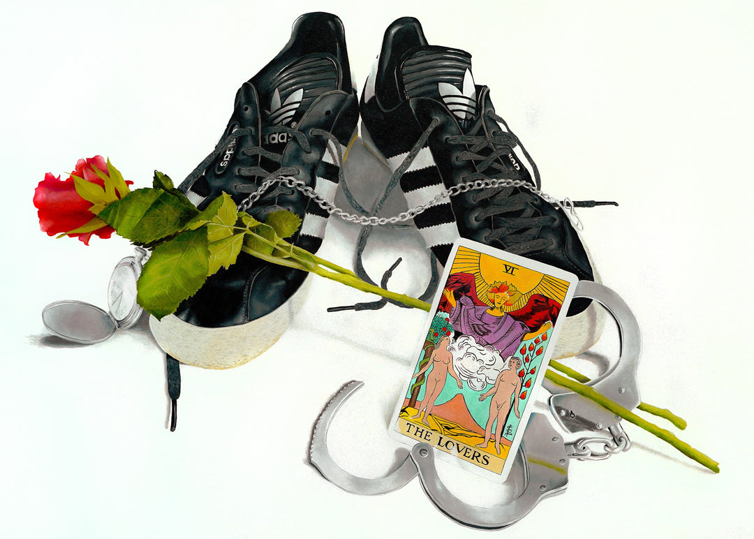 A hyper-realistic still-life painting featuring a pair of black Adidas trainers linked with a metal chain, a red rose placed across them, an open silver pocket watch, a pair of handcuffs and a brightly coloured Lovers tarot card leaning against the shoes. All objects are arranged on a clean white background with crisp lighting and detailed textures.