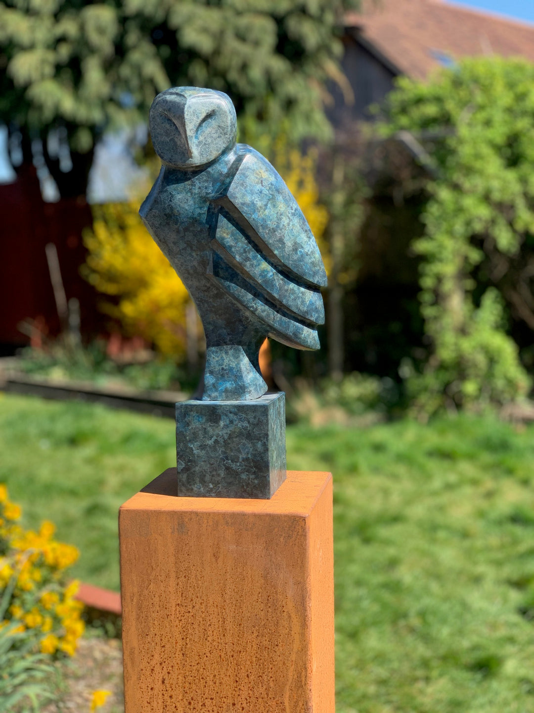 Marie Ackers The Midnight Owl bronze sculpture, limited edition, in deep blue-green patina. Stylised owl form perched on a rusted plinth, signed, numbered and foundry stamped, suitable for both indoor and outdoor display.