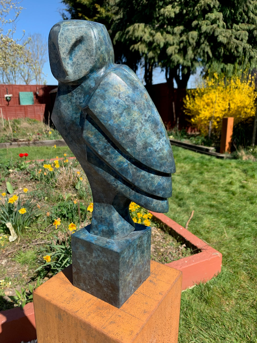 Marie Ackers The Midnight Owl bronze sculpture, limited edition, in deep blue-green patina. Stylised owl form perched on a rusted plinth, signed, numbered and foundry stamped, suitable for both indoor and outdoor display.