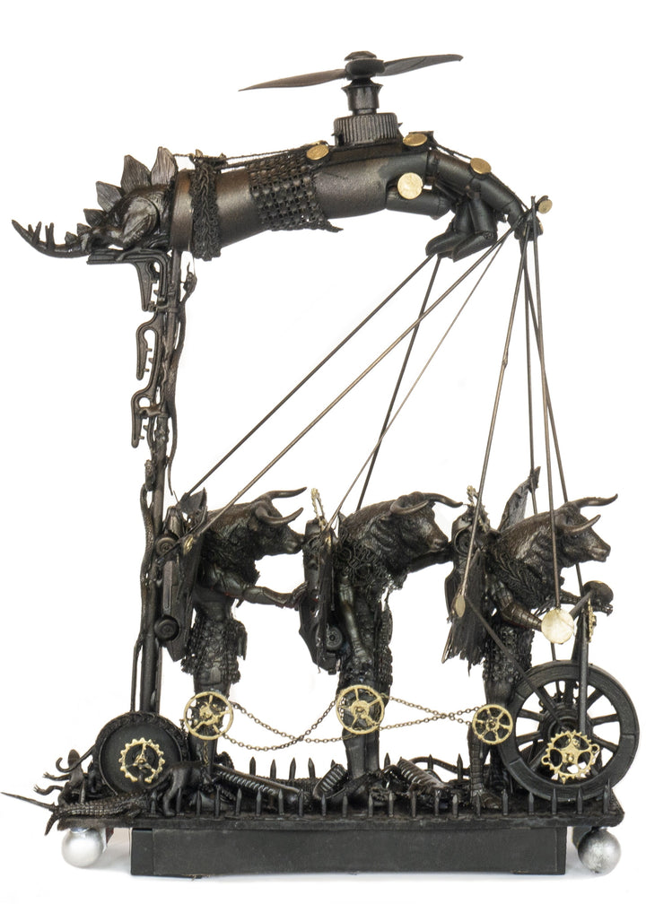 “Three Minotaurs on Their Way to a Dance” by Andrew Stevens – a one-off steampunk sculpture crafted from recycled metal and found objects, featuring three hybrid Minotaur figures with mechanical wings and gears, finished in dark bronze patina.
