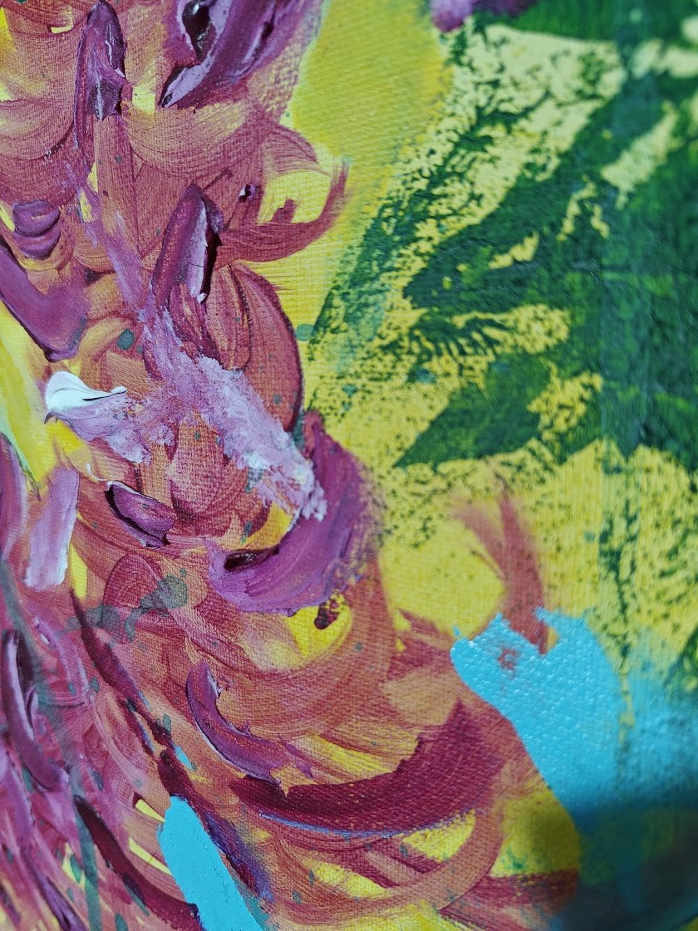 Vivid abstract painting with bold magenta florals, dripping green strokes, and splashes of blue over a bright yellow background