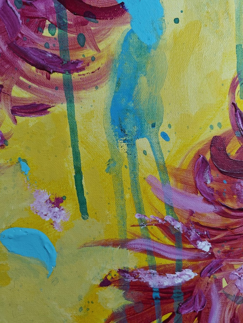 Vivid abstract painting with bold magenta florals, dripping green strokes, and splashes of blue over a bright yellow background