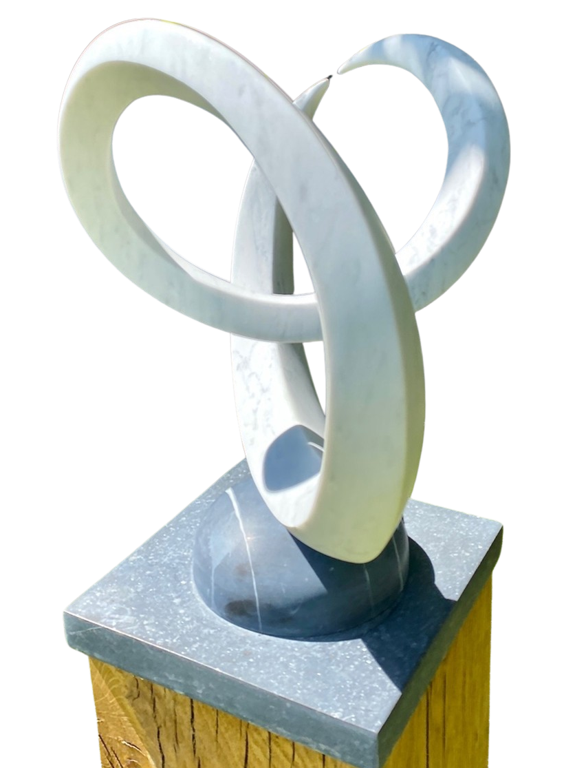 Abstract marble sculpture Twin Peaks – 2025 by Hamish Holman, hand-carved from Carrara marble into two interlocking looping peaks with smooth white veined stone, mounted on a dark stone base for contrast.
