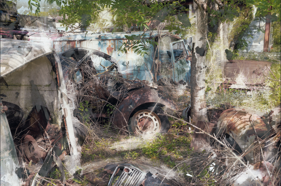 A layered, semi-surreal image of an overgrown car graveyard, where rusted vintage vehicles, tangled branches, and decaying metal parts intertwine with encroaching greenery. A faded turquoise van, oxidised car doors, and fragmented bonnets merge into a dreamlike scene, partially obscured by soft, chemical-like textures and ghostly double exposures.