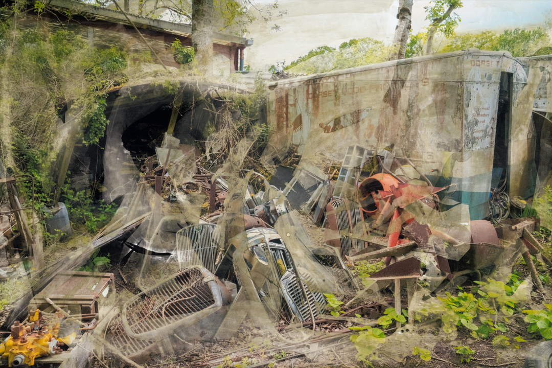 A chaotic yet painterly scene of an abandoned scrapyard, where rusted engine parts, dismantled grilles, and decayed industrial objects lie strewn across the ground. Overgrown vegetation pierces through the debris, while ghost-like layers of metal and machinery are softened by textured overlays and chemical surface treatments. The faded lettering on a derelict lorry hints at its forgotten past, creating a compelling juxtaposition between mechanical ruin and encroaching nature.
