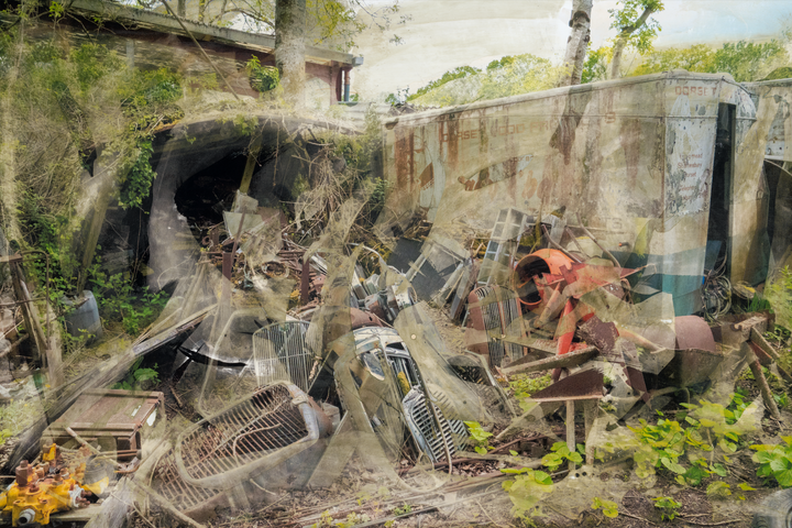 A chaotic yet painterly scene of an abandoned scrapyard, where rusted engine parts, dismantled grilles, and decayed industrial objects lie strewn across the ground. Overgrown vegetation pierces through the debris, while ghost-like layers of metal and machinery are softened by textured overlays and chemical surface treatments. The faded lettering on a derelict lorry hints at its forgotten past, creating a compelling juxtaposition between mechanical ruin and encroaching nature.