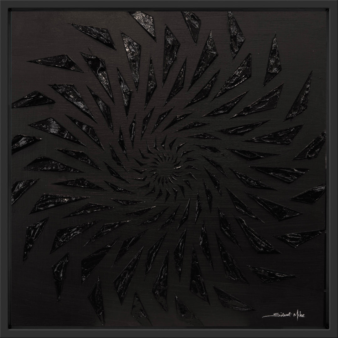 Black-on-black contemporary wall artwork by Mike Philp with angular geometric forms spiralling inward across a dark ground. Subtle texture and shadow create depth, movement, and quiet intensity.