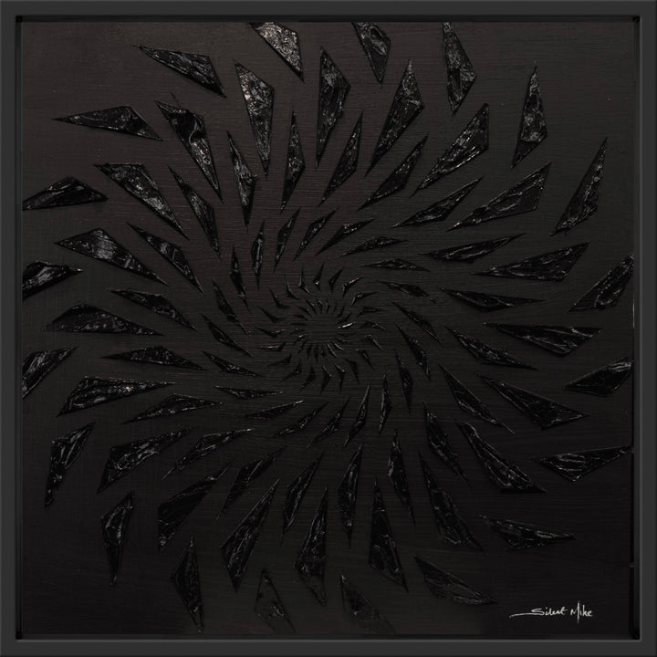 Black-on-black contemporary wall artwork by Mike Philp with angular geometric forms spiralling inward across a dark ground. Subtle texture and shadow create depth, movement, and quiet intensity.