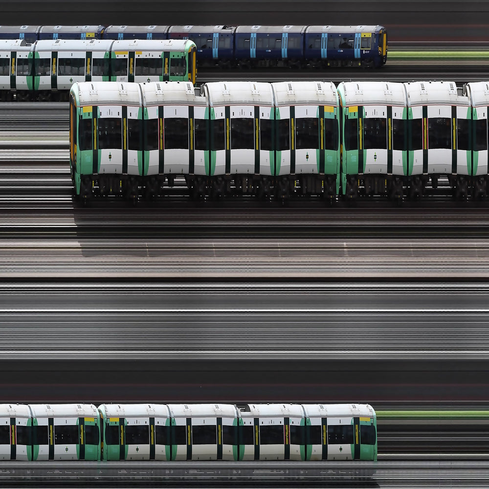 Richard P Jones Victoria Junction, London fine art photographic print showing layered London Underground and rail trains moving through a junction of tracks, created from reconstructed high-speed video imagery and printed as a giclée on brushed aluminium.