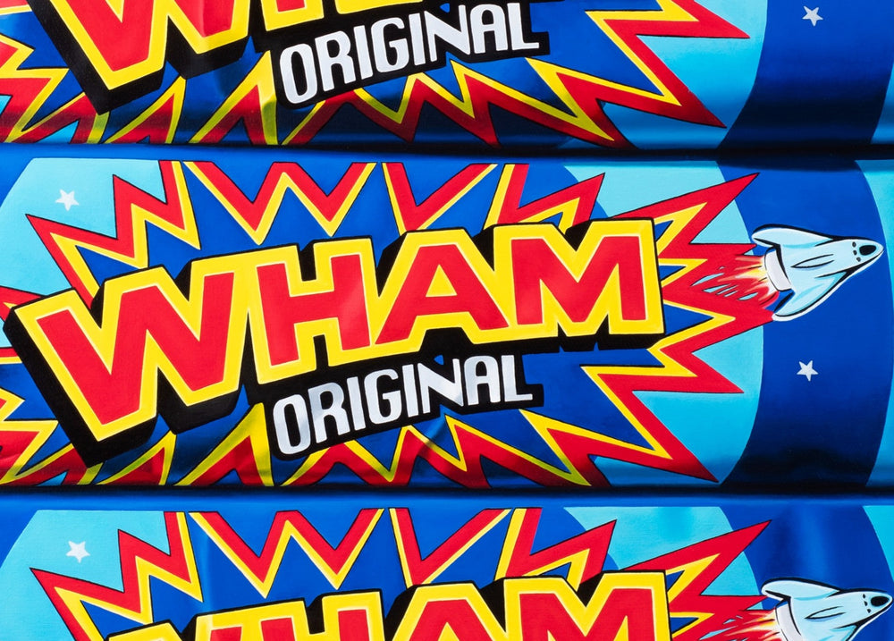 Kelly-Anne Davitt Wham Wham Wham hyperreal oil painting on canvas depicting stacked Barratt Wham Original sweet bars with glossy blue wrappers and bold red and yellow graphics.