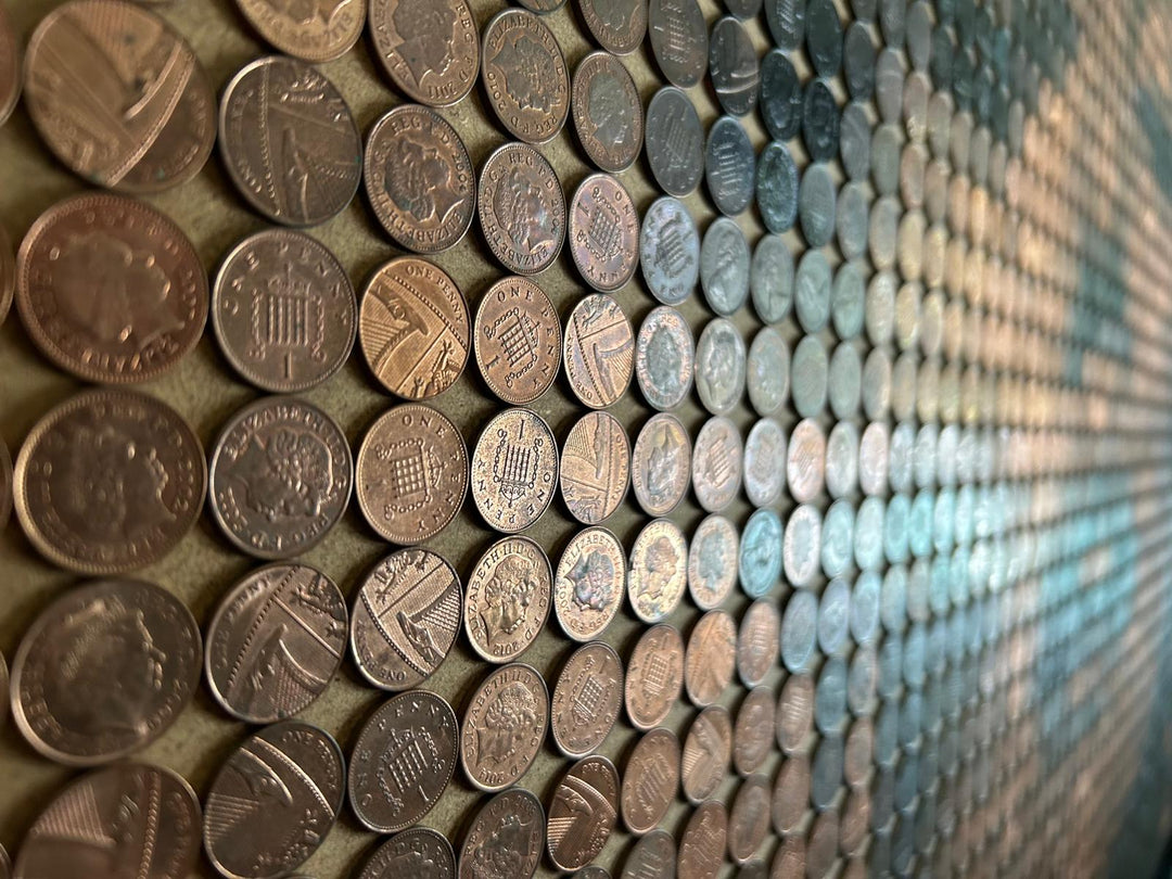 Ed Chapman mosaic portrait of Marilyn Monroe created from 2,301 one penny coins, forming a shimmering likeness through copper, bronze, and dark patina tones, a striking pop culture artwork blending currency and fine art.
