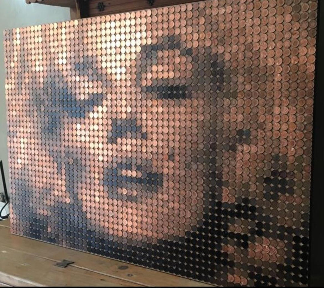 Ed Chapman mosaic portrait of Marilyn Monroe created from 2,301 one penny coins, forming a shimmering likeness through copper, bronze, and dark patina tones, a striking pop culture artwork blending currency and fine art.