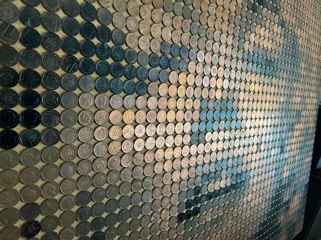 Ed Chapman mosaic portrait of Marilyn Monroe created from 2,301 one penny coins, forming a shimmering likeness through copper, bronze, and dark patina tones, a striking pop culture artwork blending currency and fine art.