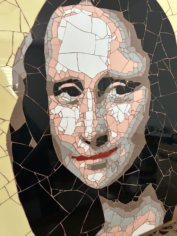 Ed Chapman Mosaic portrait of the Mona Lisa constructed from precisely cut ceramic tiles, with angular fragments forming the face, hair and clothing through subtle tonal shifts, set against a bold yellow background and creating a structured, tactile surface with visible tile joins and rhythmic patterning.
