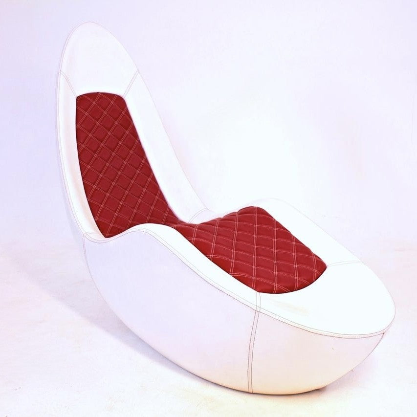 “Caillou Chaise – Leather” by Ben Rousseau – a sculptural chaise in white leather with quilted red stitching, inspired by automotive interiors. Handcrafted in composite with full leather upholstery, merging comfort, craftsmanship, and design.

