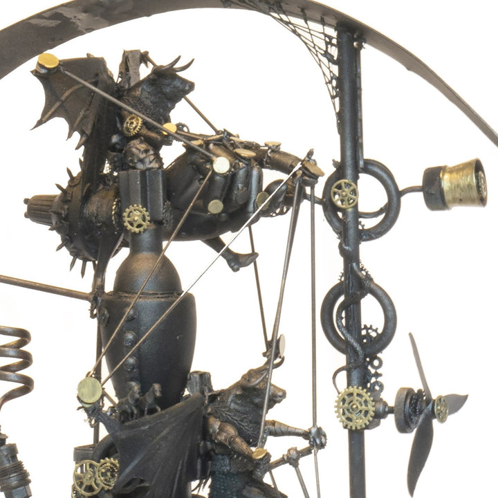 “Winged Minotaur VII” by Andrew Stevens – a one-off steampunk sculpture fusing myth and machinery. Crafted from recycled car parts, brass gears and found materials, finished in dark bronze patina with intricate mechanical detail and winged figures.