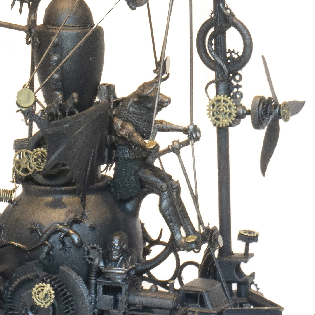 “Winged Minotaur VII” by Andrew Stevens – a one-off steampunk sculpture fusing myth and machinery. Crafted from recycled car parts, brass gears and found materials, finished in dark bronze patina with intricate mechanical detail and winged figures.