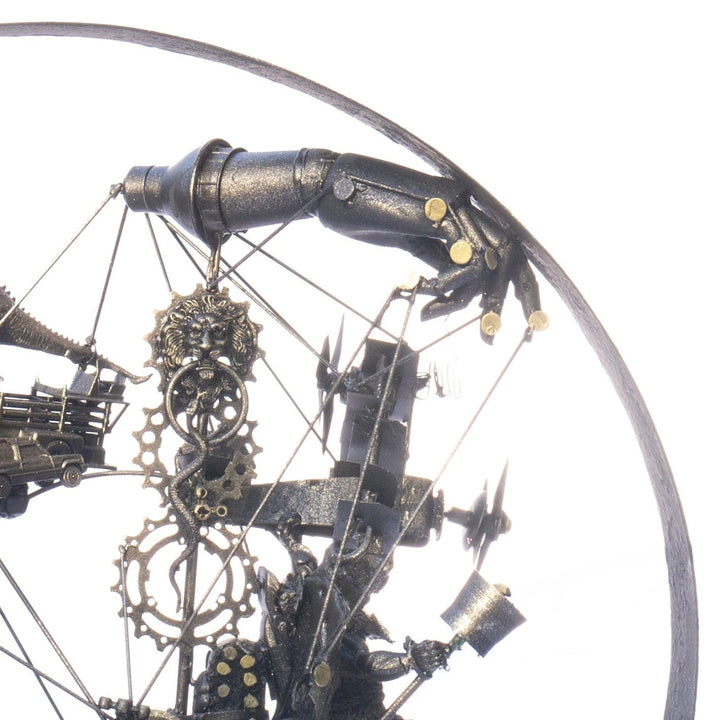 Steampunk-inspired recycled sculpture featuring a winged minotaur form built from broken toys, gears, metal parts and found materials, all finished in a dark bronze patina within a circular frame.