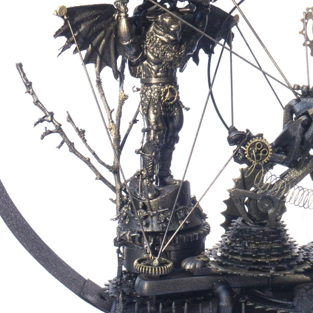 Steampunk-inspired recycled sculpture featuring a winged minotaur form built from broken toys, gears, metal parts and found materials, all finished in a dark bronze patina within a circular frame.